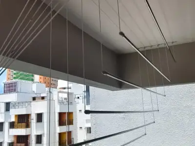Ceiling-mounted drying hanger on a balcony (close-up view)