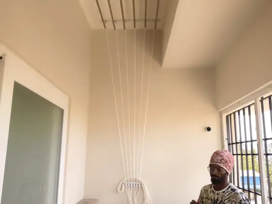 Ceiling-mounted drying hanger on a balcony (finished installation)