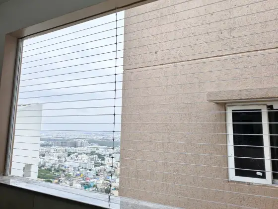 Horizontal invisible grill on an apartment balcony (close-up view)