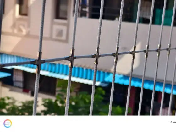 Stainless-steel cable grill on a high-rise balcony in Chennai