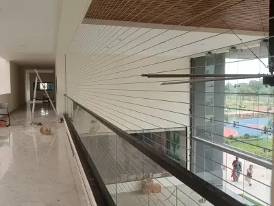 Slim cable grill keeping a balcony view clear in Chennai (wider view)