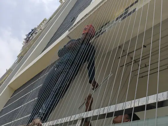 Invisible grill fitted across an apartment balcony (finished installation)