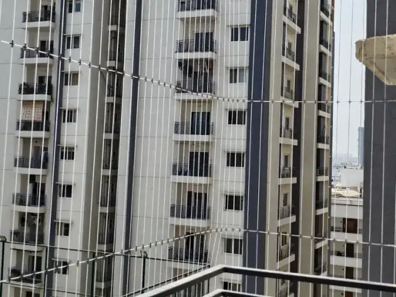 Stainless-steel cable grill on a high-rise balcony in Thoraipakkam, Chennai (finished installation)