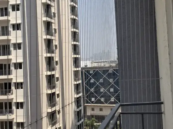 Stainless-steel cable grill on an L-shaped opening in Besant Nagar, Chennai