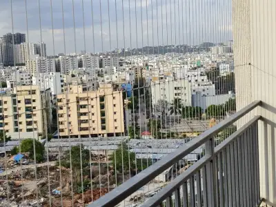 Stainless-steel cable grill on a high-rise balcony in Chennai (site photo)