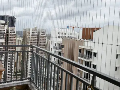 Invisible grill fitted across an apartment balcony (another angle)