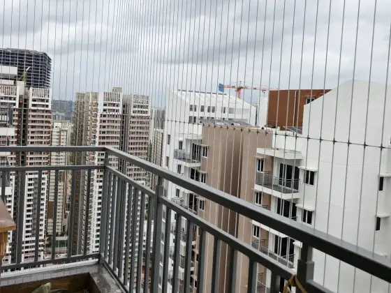Invisible grill fitted across an apartment balcony (another angle)