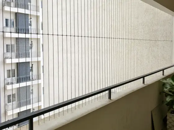 Slim cable grill keeping a balcony view clear (another angle)