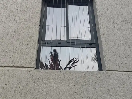 Slim stainless-steel window grill in Chennai