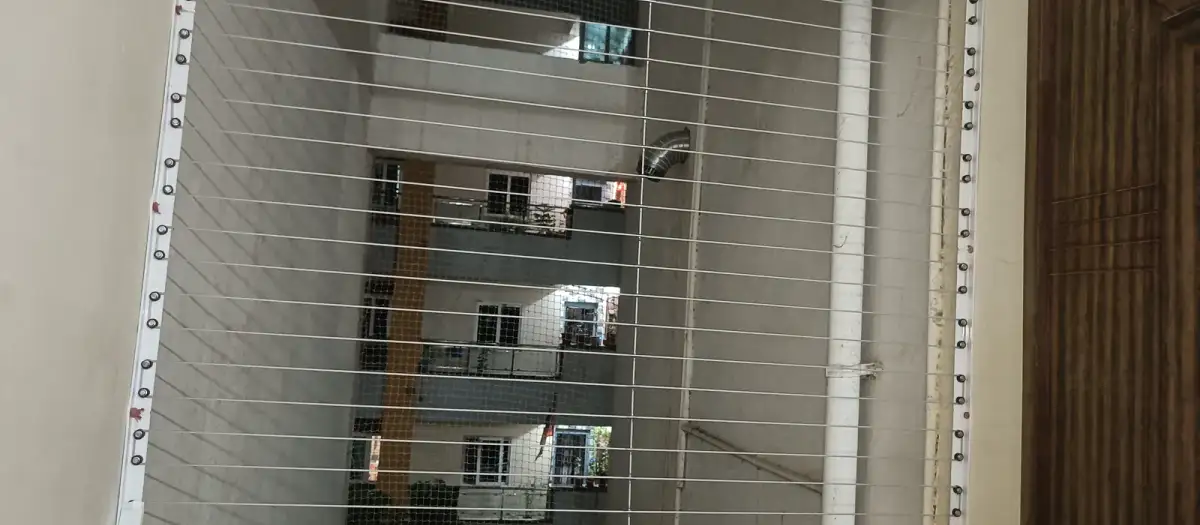 Slim stainless-steel window grill (close-up view)