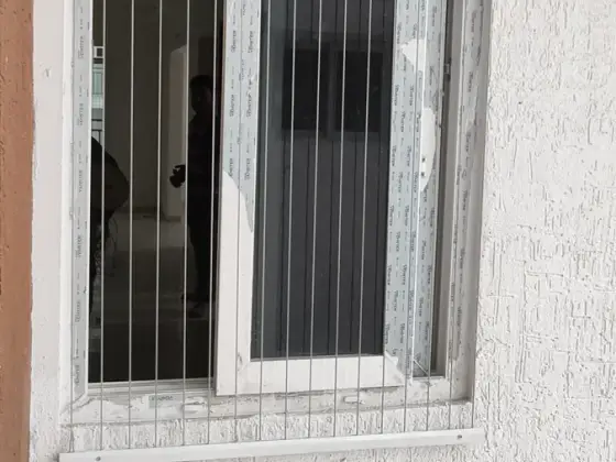 Window secured with an invisible grill in Porur, Chennai (close-up view)