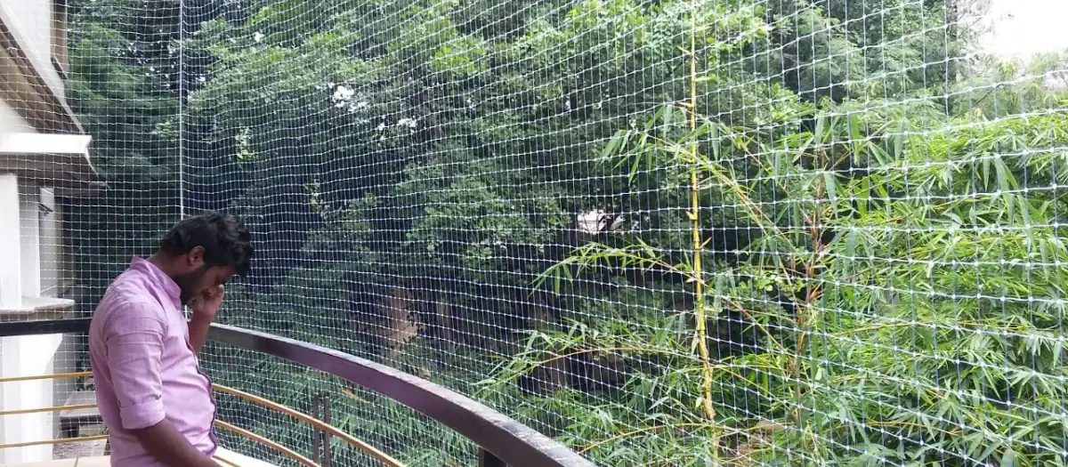 Pigeon net installed on a high-rise balcony