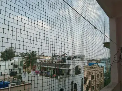 Balcony bird-proofed with a pigeon net in Chennai (close-up view)
