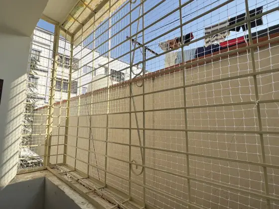 Safety net fitted across an apartment balcony in Chennai