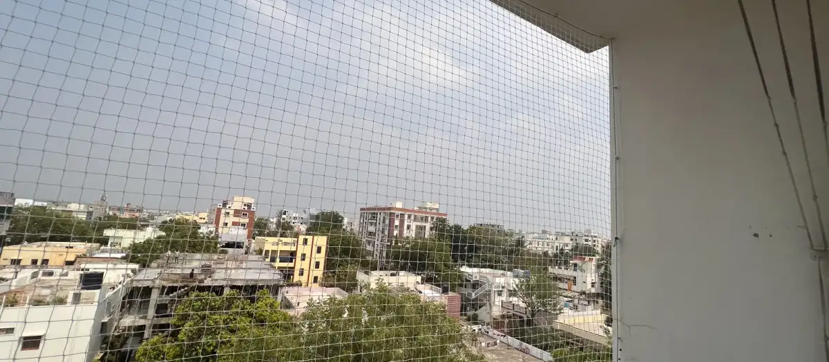 Tensioned safety net on a high-rise balcony in Chennai