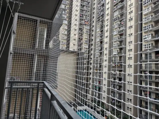Tensioned safety net on a high-rise balcony (wider view)