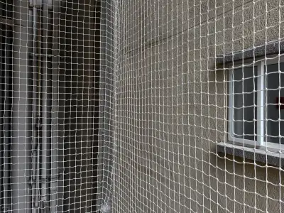 Clear safety net protecting an open balcony in Chennai (wider view)