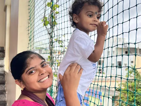 Fine-mesh safety net protecting a child's play area in Tondiarpet, Chennai (close-up view)