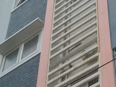 Net over an open service duct in a residential building in Chennai