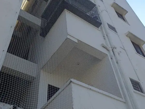 Duct area protected with a fine mesh net in Anna Nagar, Chennai (close-up view)