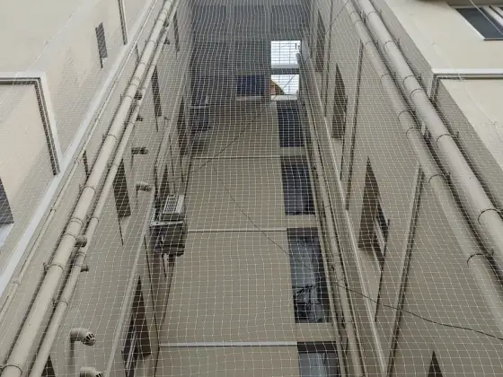 Duct shaft net installed between floors (wider view)