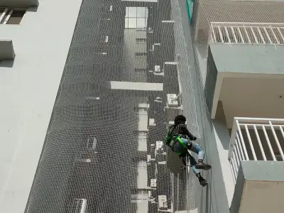 Net over an open service duct in a residential building in Chennai (finished installation)