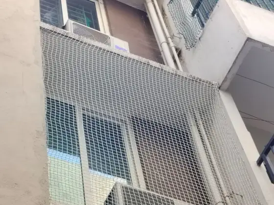 Discreet net installed across a window