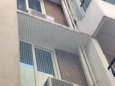 Discreet net installed across a window in Chennai