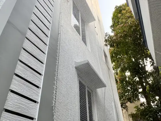 Building safety net installed by rope access in Chennai