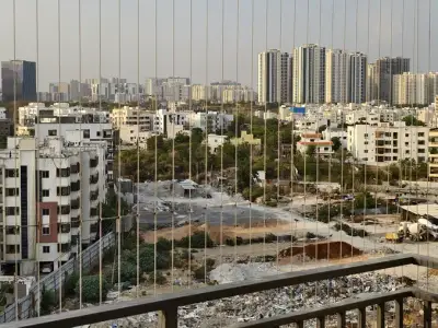 Vertical invisible grill on an apartment balcony (wider view)