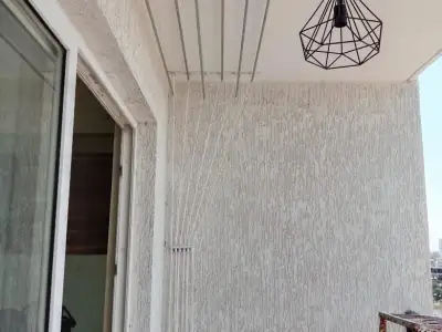 Wall-mounted drying hanger in a utility area in Chennai (finished installation)